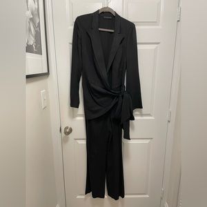 Elegant black Donna Karan jumpsuit size 8. With side zipper and wide legs.
